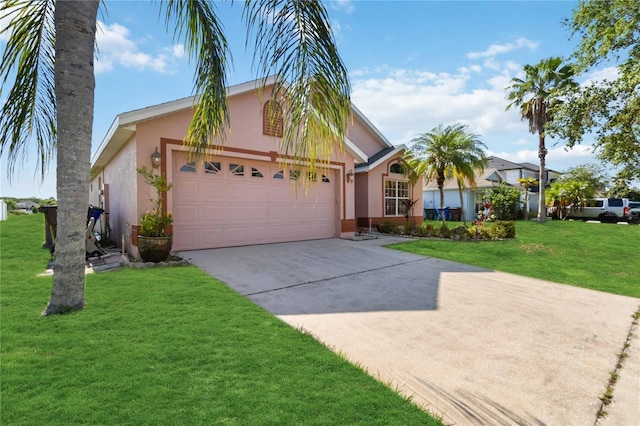 2481 Deer Creek Blvd, Saint Cloud, FL 34772 - view of front facade with stucco siding, concrete driveway, an attached garage, and a front lawn