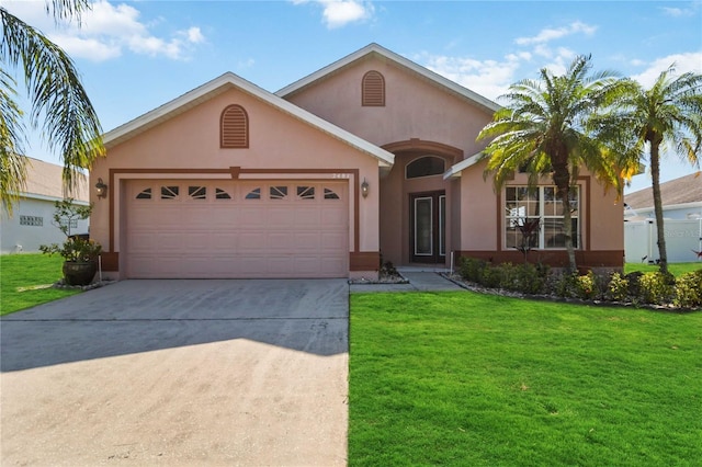 2481 Deer Creek Blvd, Saint Cloud, FL 34772 - view of front of house featuring stucco siding, concrete driveway, a front yard, and an attached garage