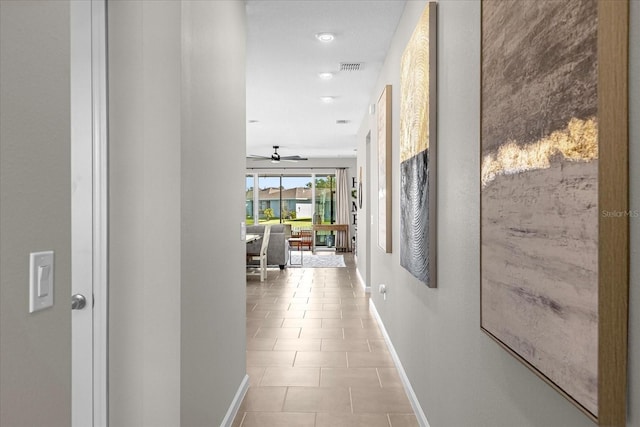284 White Heron Way, Saint Cloud, FL 34772 - hallway with baseboards, light tile patterned floors, and recessed lighting