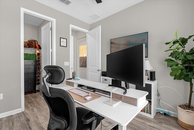 284 White Heron Way, Saint Cloud, FL 34772 - office area featuring light wood-type flooring and baseboards