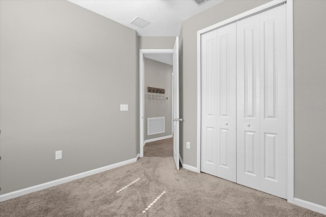 284 White Heron Way, Saint Cloud, FL 34772 - unfurnished bedroom with a closet, carpet floors, and baseboards