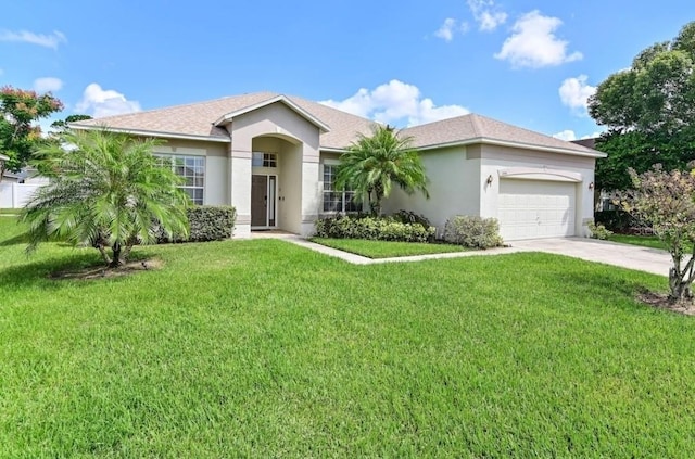 236 Boxwood Dr, Davenport, FL 33837 - ranch-style home with a garage, stucco siding, driveway, and a front lawn