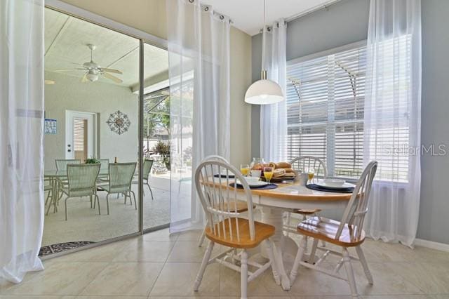 236 Boxwood Dr, Davenport, FL 33837 - tiled dining area with healthy amount of natural light and a ceiling fan