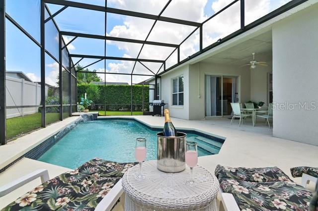 236 Boxwood Dr, Davenport, FL 33837 - view of pool with a patio and a ceiling fan