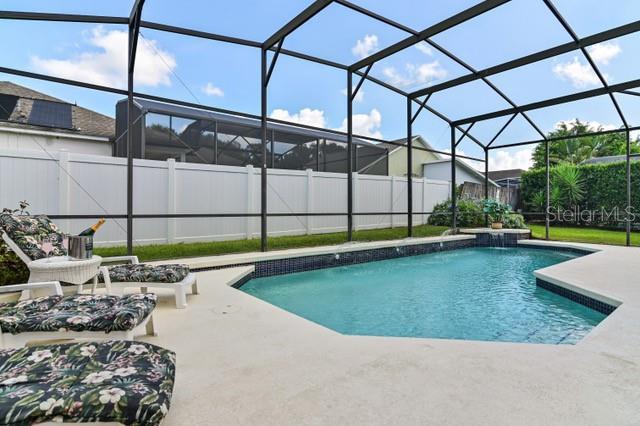 236 Boxwood Dr, Davenport, FL 33837 - view of swimming pool with a patio, a fenced backyard, and glass enclosure