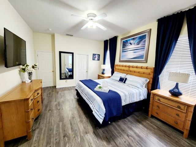 236 Boxwood Dr, Davenport, FL 33837 - bedroom featuring dark wood-style floors and ceiling fan
