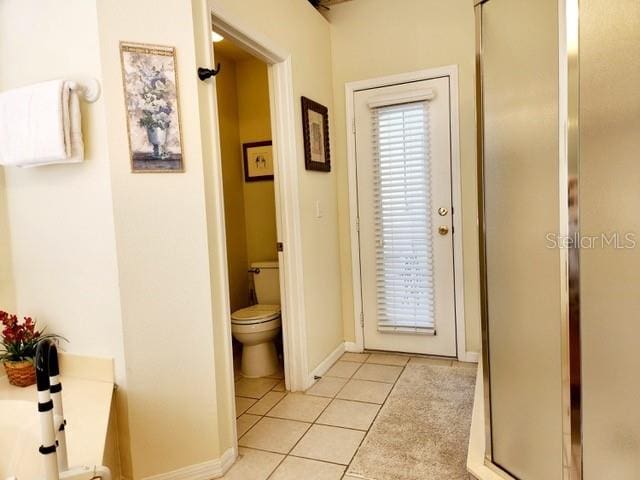 236 Boxwood Dr, Davenport, FL 33837 - bathroom with tile patterned floors, toilet, and baseboards