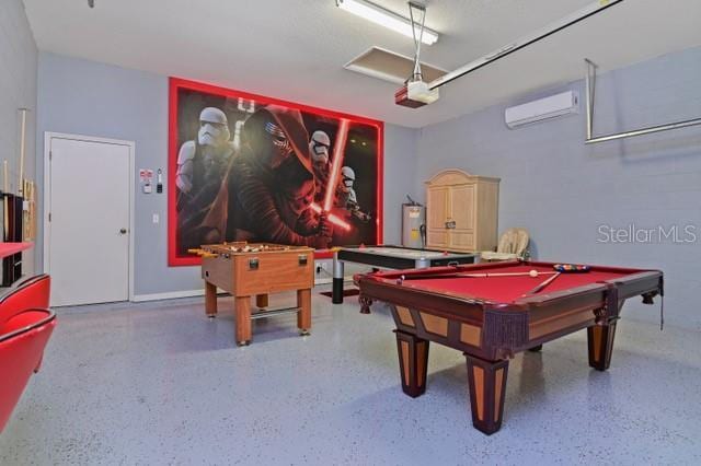 236 Boxwood Dr, Davenport, FL 33837 - game room with a wall mounted air conditioner, speckled floor, pool table, and a garage