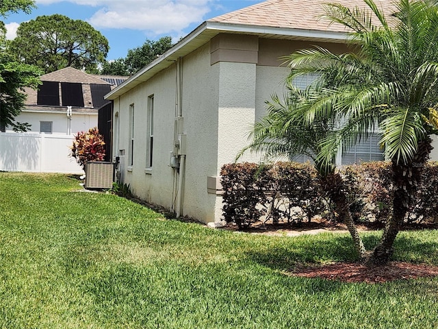 236 Boxwood Dr, Davenport, FL 33837 - view of home's exterior featuring stucco siding and cooling unit