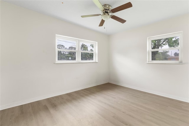 5115 W Livingston St, Orlando, FL 32811 - unfurnished room featuring wood finished floors and a ceiling fan