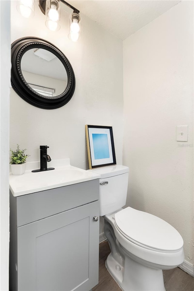 5115 W Livingston St, Orlando, FL 32811 - half bathroom with vanity and wood finished floors
