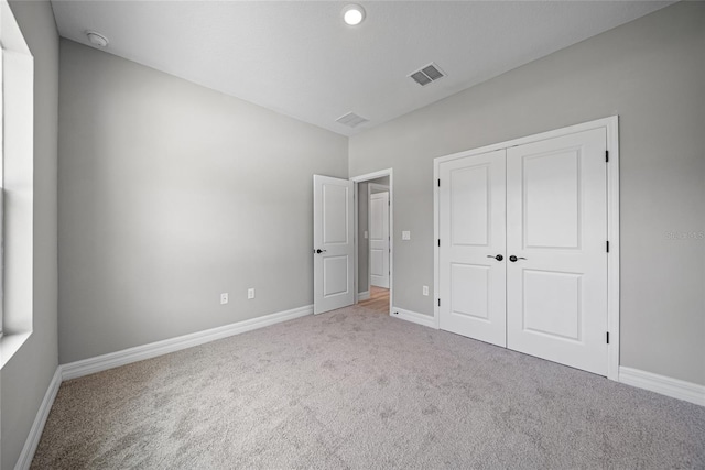 3944 SW 130th Loop, Ocala, FL 34473 - unfurnished bedroom with carpet flooring, baseboards, and a closet