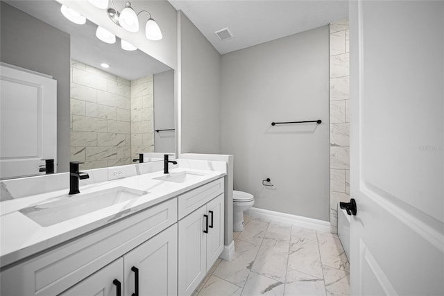 3944 SW 130th Loop, Ocala, FL 34473 - full bathroom featuring marble look tiles, double vanity, toilet, baseboards, and tiled shower
