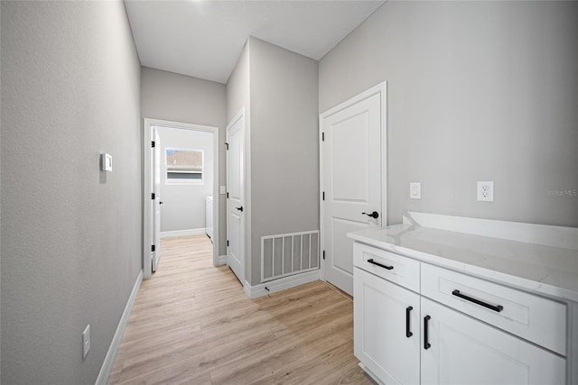 3944 SW 130th Loop, Ocala, FL 34473 - hall with light wood-style flooring and baseboards