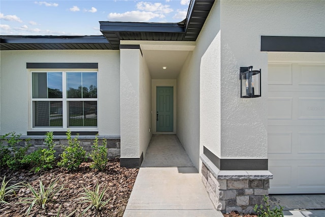 3944 SW 130th Loop, Ocala, FL 34473 - entrance to property with stucco siding, an attached garage, and stone siding