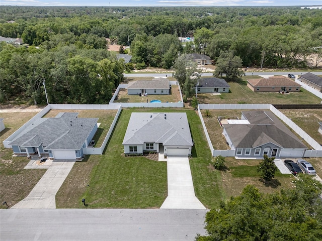 3944 SW 130th Loop, Ocala, FL 34473 - aerial perspective of suburban area with a forest