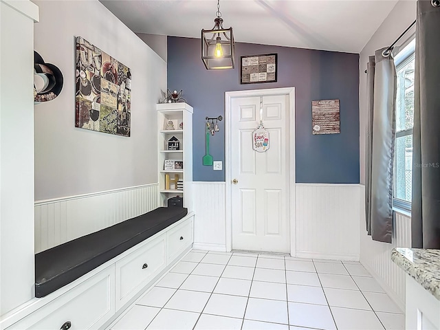 3104 Lime Tree Dr, Edgewater, FL 32141 - foyer featuring wainscoting, light tile patterned floors, and vaulted ceiling