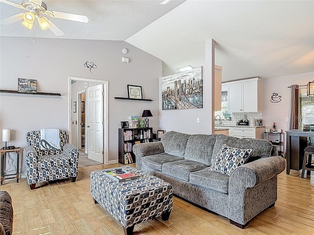 3104 Lime Tree Dr, Edgewater, FL 32141 - living room with ceiling fan, lofted ceiling, and light wood-style floors