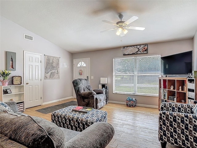 3104 Lime Tree Dr, Edgewater, FL 32141 - living room featuring plenty of natural light, a ceiling fan, light wood-type flooring, and lofted ceiling