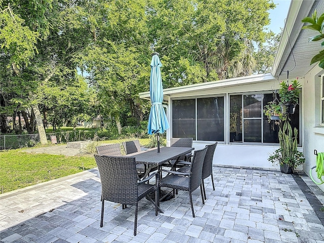 3104 Lime Tree Dr, Edgewater, FL 32141 - view of patio / terrace featuring a sunroom and outdoor dining space