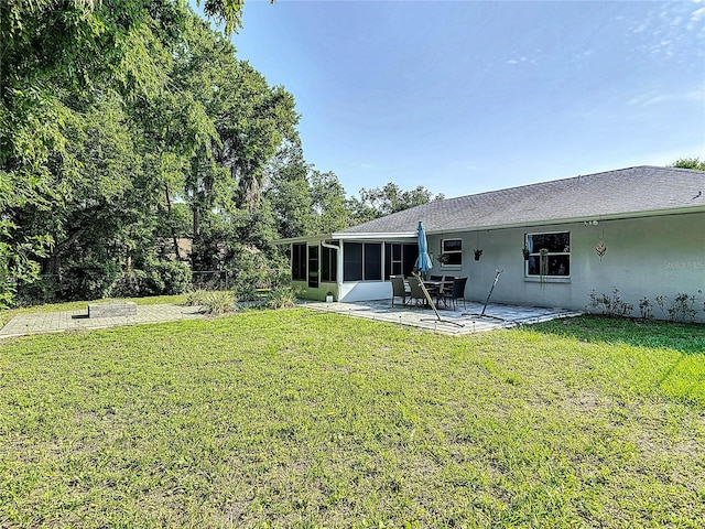 3104 Lime Tree Dr, Edgewater, FL 32141 - view of green lawn featuring a sunroom and a patio area