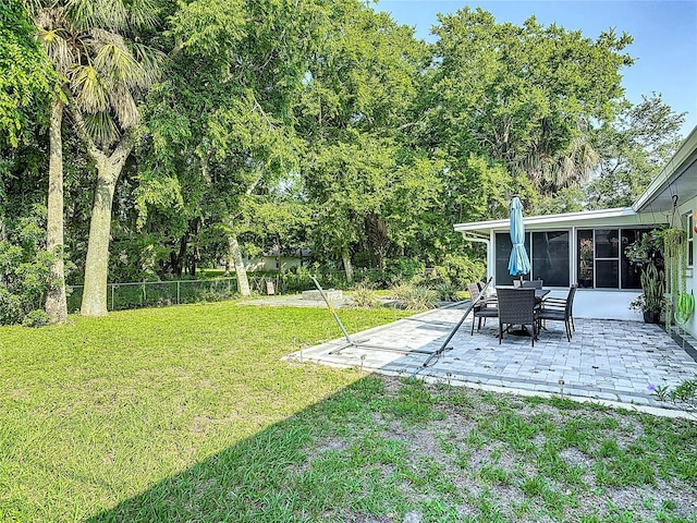3104 Lime Tree Dr, Edgewater, FL 32141 - view of yard with a patio area and a sunroom