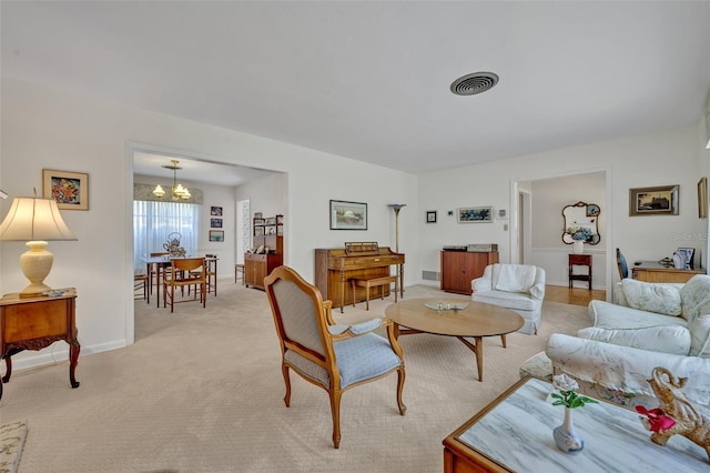 2040 Mohawk Trl, Maitland, FL 32751 - living area with a chandelier, light carpet, and baseboards