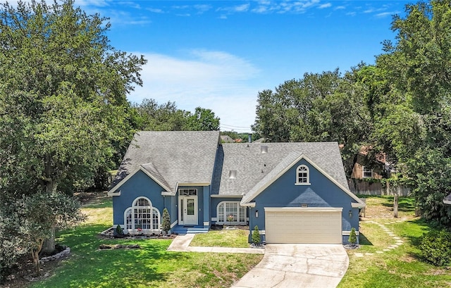 7838 Rollingridge Ct, Orlando, FL 32835 - view of front facade featuring stucco siding, concrete driveway, a garage, and a shingled roof