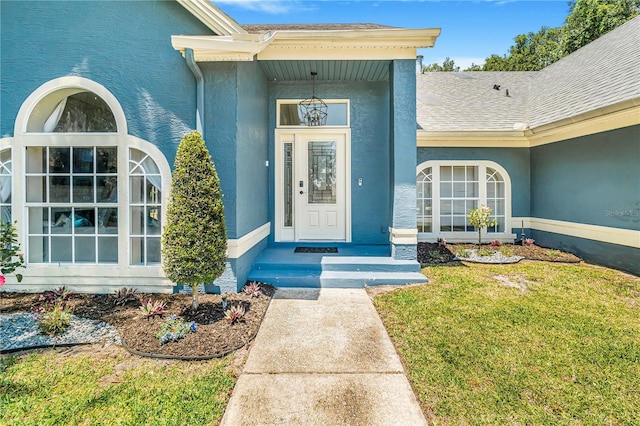 7838 Rollingridge Ct, Orlando, FL 32835 - entrance to property with stucco siding and a yard