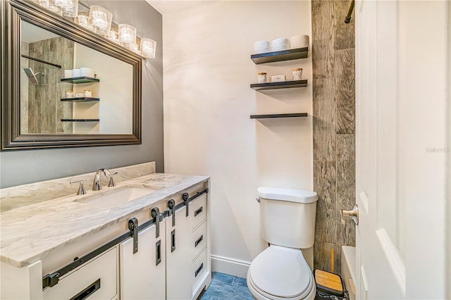 7838 Rollingridge Ct, Orlando, FL 32835 - bathroom with toilet, vanity, a shower, and baseboards