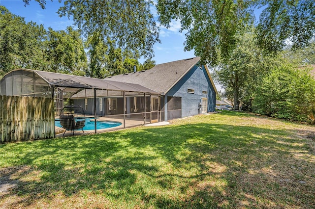 7838 Rollingridge Ct, Orlando, FL 32835 - back of house with an outdoor pool, a yard, glass enclosure, and a patio area