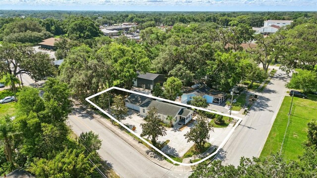 205 S Highland Ave, Apopka, FL 32703 - aerial overview of property's location featuring property parcel outlined and a forest