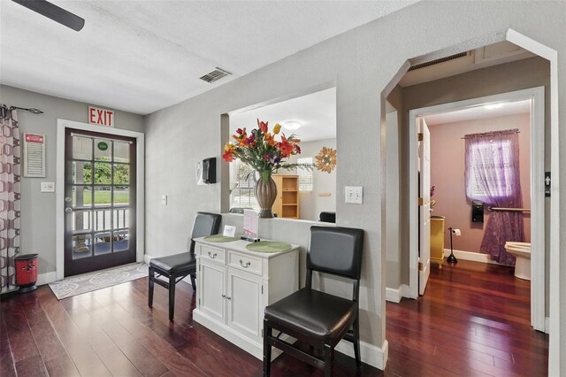 205 S Highland Ave, Apopka, FL 32703 - dining room featuring dark wood-type flooring and baseboards