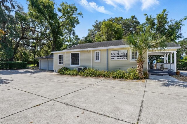 205 S Highland Ave, Apopka, FL 32703 - view of front of home featuring a detached garage and covered porch