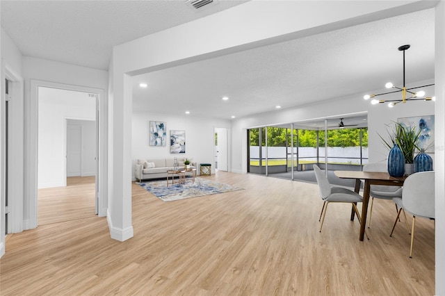2903 Clear Way, Orlando, FL 32805 - living room with light wood-style flooring, recessed lighting, a chandelier, and a ceiling fan