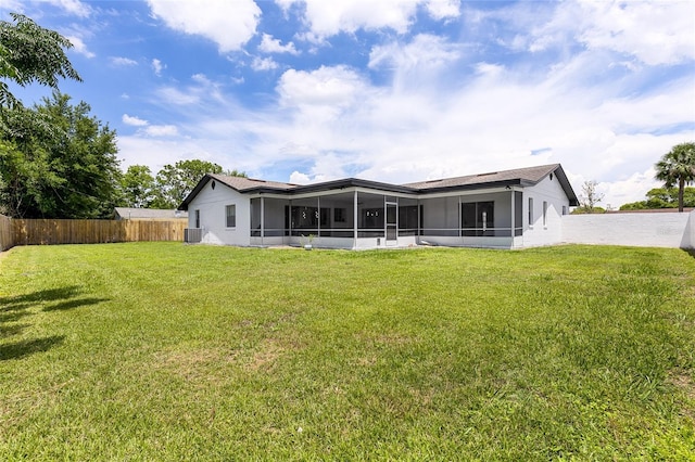 2903 Clear Way, Orlando, FL 32805 - back of property featuring a sunroom and a fenced backyard