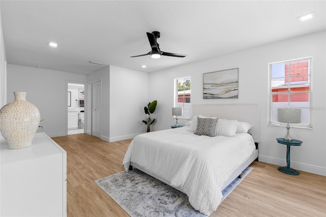 2903 Clear Way, Orlando, FL 32805 - bedroom featuring light wood-style flooring, recessed lighting, ceiling fan, and ensuite bathroom