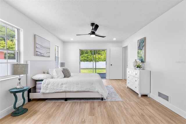2903 Clear Way, Orlando, FL 32805 - bedroom featuring access to exterior, multiple windows, light wood-style flooring, a ceiling fan, and recessed lighting