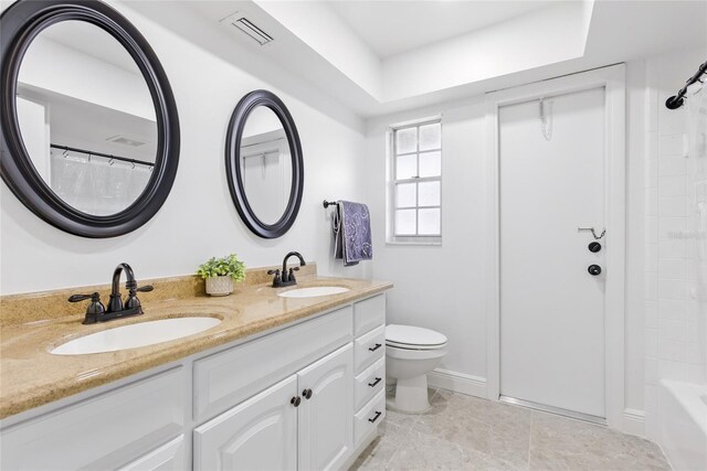2903 Clear Way, Orlando, FL 32805 - full bath with double vanity, a tray ceiling, and shower / tub combo with curtain