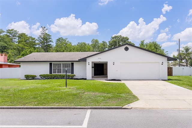 2903 Clear Way, Orlando, FL 32805 - view of front of home featuring an attached garage, driveway, and brick siding