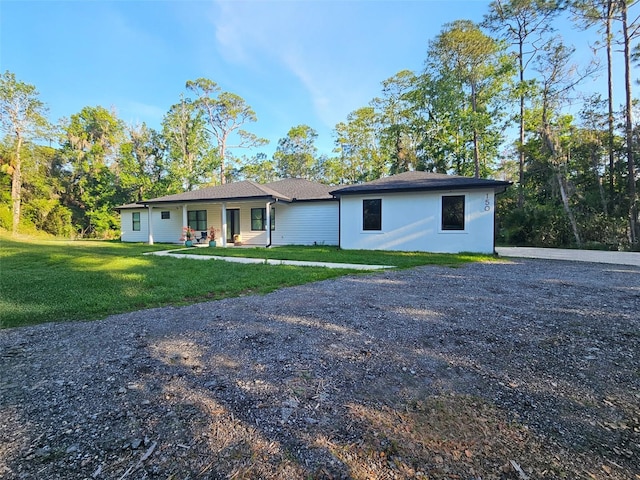 4825 N Fort Christmas Rd, Christmas, FL 32709 - single story home featuring a front lawn and a porch