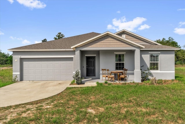 123 Zinnia Ln W, Poinciana, FL 34759 - view of front of property featuring an attached garage, concrete driveway, stucco siding, a front yard, and roof with shingles