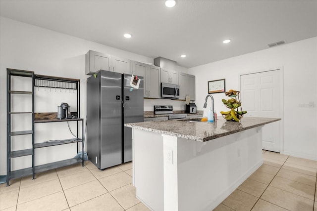 123 Zinnia Ln W, Poinciana, FL 34759 - kitchen with stainless steel appliances, a sink, light tile patterned floors, gray cabinetry, and recessed lighting
