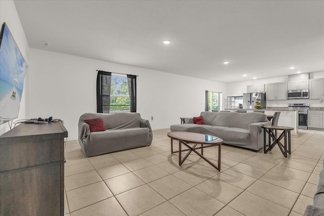 123 Zinnia Ln W, Poinciana, FL 34759 - living area featuring light tile patterned floors and recessed lighting
