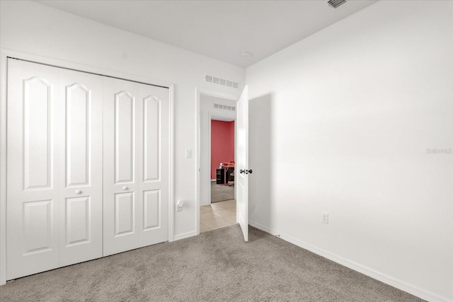 123 Zinnia Ln W, Poinciana, FL 34759 - unfurnished bedroom with carpet floors, a closet, and baseboards