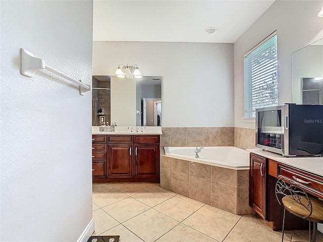3213 Kentshire Blvd, Ocoee, FL 34761 - bathroom with a bath, vanity, and tile patterned flooring