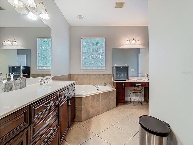 3213 Kentshire Blvd, Ocoee, FL 34761 - bathroom with plenty of natural light, a garden tub, tile patterned flooring, and vanity