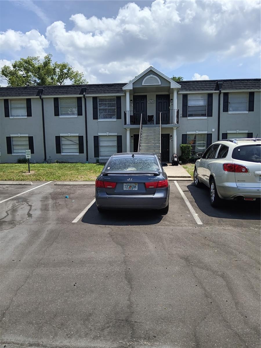7628 Forest City Rd 054 A/K/A Unit F, Orlando, FL 32810 - view of property featuring uncovered parking