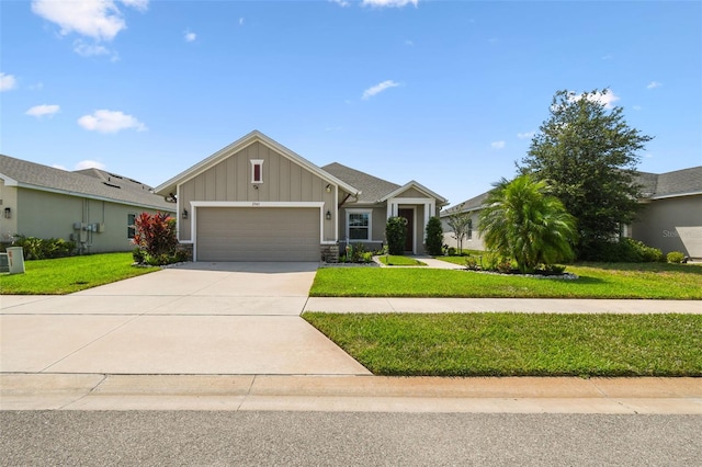 2941 Marlberry Ln, Clermont, FL 34714 - view of front of house featuring board and batten siding, an attached garage, a front yard, and concrete driveway