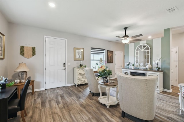 2941 Marlberry Ln, Clermont, FL 34714 - living area with wood finished floors, a ceiling fan, and recessed lighting